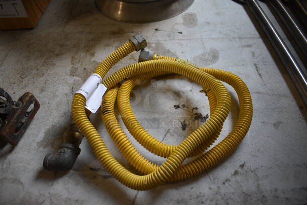 2 Yellow Gas Hoses. 24