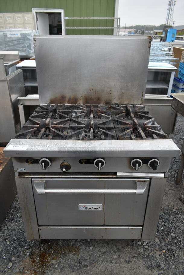 Garland G36-6R Stainless Steel Commercial Natural Gas Powered 6 Burner Range w/ Oven and Back Splash. - Image 1 of 7