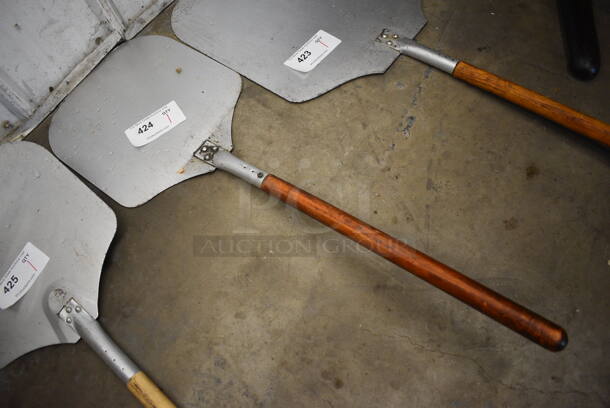 Metal Pizza Peel w/ Wooden Handle. 12x35x1 - Image 1 of 3