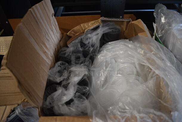 Box of Black Plastic Container Bases and Clear Lids