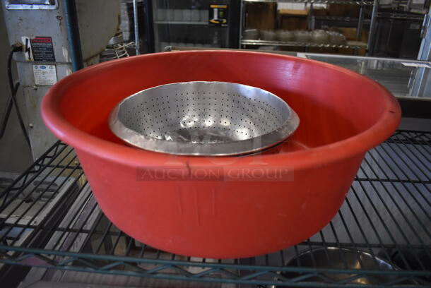 3 Various Items; 2 Metal Colanders and 1 Red Poly Bowl. Includes 13x13x4, 21x21x7. 3 Times Your Bid!