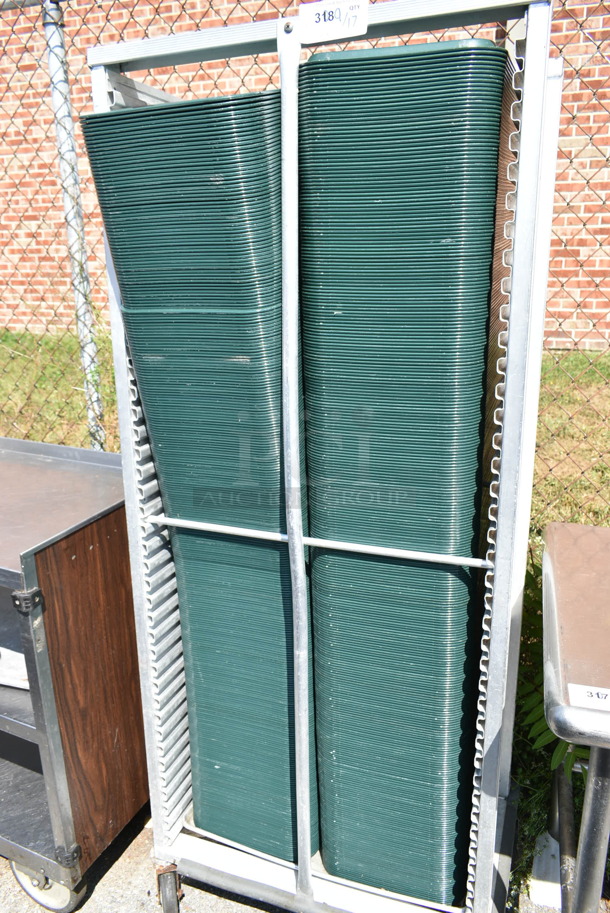 Metal Pan Transport Rack on Commercial Casters w/ Approximately 220 Green Poly Trays.  - Image 3 of 5