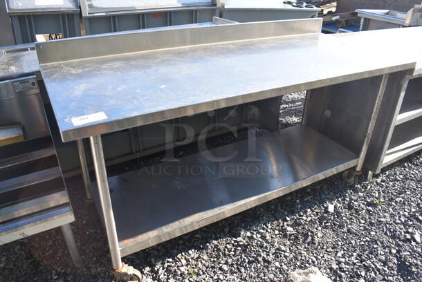 Stainless Steel Table w/ Under Shelf and Back Splash on Commercial Casters. 72x30x40