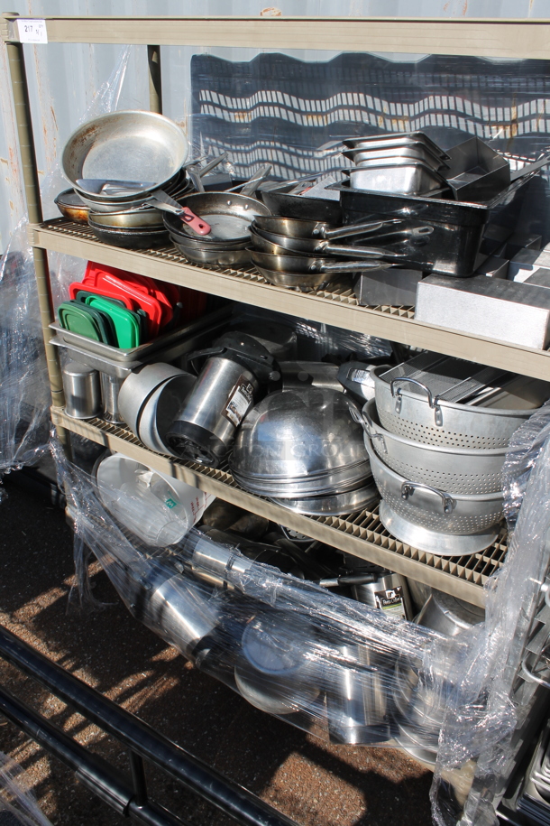4 Tier Shelving Unit w/ Contents. BUYER MUST DISMANTLE. PCI CANNOT DISMANTLE FOR SHIPPING. PLEASE CONSIDER FREIGHT CHARGES. - Image 1 of 5