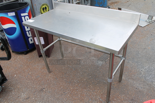 Stainless Steel Table w/ Back Splash. 
