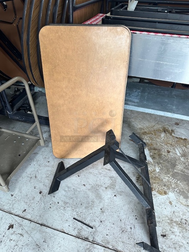 One Laminate Table Top With A Black Metal Wall Mount Table Base. 24X42 - Image 1 of 1