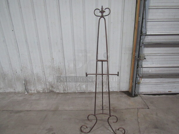 One Brown Metal Easel.