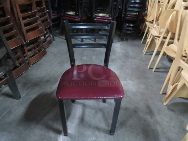 Black Metal Chair With A Burgundy Cushioned Seat. 4XBID - Image 1 of 3