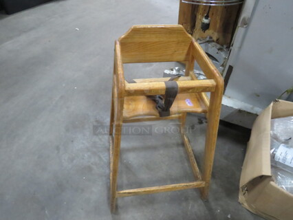 One Wooden High Chair.