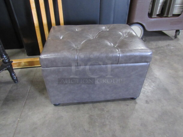 One Gray Pleather Ottoman With Lift Up Top For Storage. 24X18X16