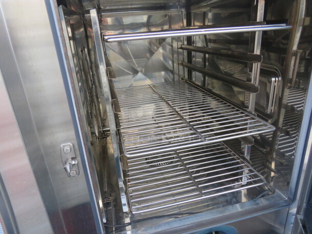 One Rational Combi Master Natural Gas Oven On SS Stand With SS Under Shelf on Casters. Unable To Test. 120 Volt. Model# CM-81G. 34X34X57.5.  - Image 3 of 3
