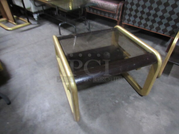 One Wooden Side Table Painted Brown/Gold With A Glass Top And 1 Shelf. 28X28X20