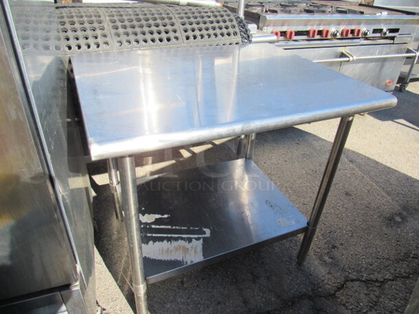 One Stainless Steel Table With Stainless Under Shelf. 36X30X34