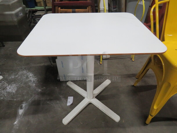 One White Laminate Table Top On A Pedestal Base. 24X28X29.5 - Image 1 of 1
