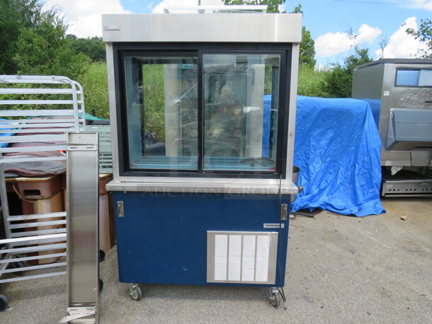 One Delfield Refrigerator With 3 Racks, On Casters. # KC-50-NU-SERVIEW. 120 Volt. 50X30X78