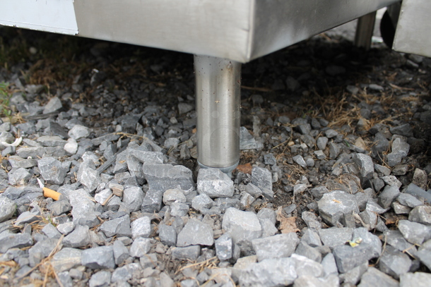 BRAND NEW SCRATCH AND DENT! Stainless Steel Table w/ Back Splash and 2 Under Shelves. - Image 5 of 5
