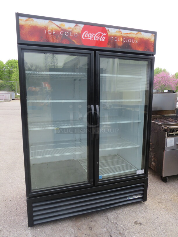 One WORKING True 2 Door Refrigerated Glass Display Merchandiser With 7 Racks. Model# GDM-49-HC-TSL01. 115 Volt. 54X29.5X79.5