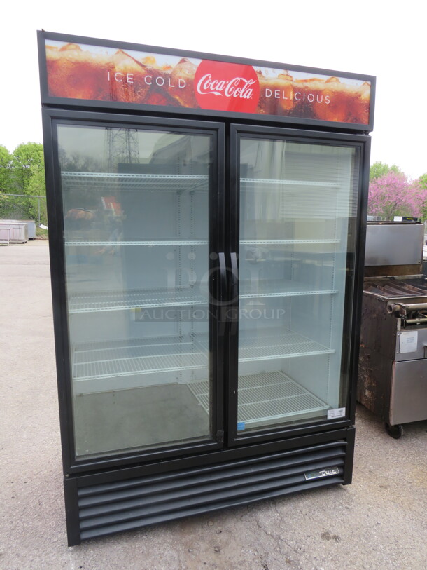 One WORKING True 2 Door Refrigerated Glass Display Merchandiser With 7 Racks. Model# GDM-49-HC-TSL01. 115 Volt. 54X29.5X79.5 - Image 1 of 2