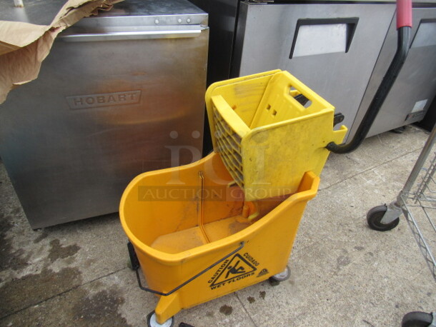 One Ocedar Mop Bucket And Wringer.