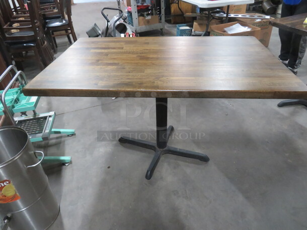 One Rectangular Solid Wooden Table Top On A Pedestal Base. 48X30X29