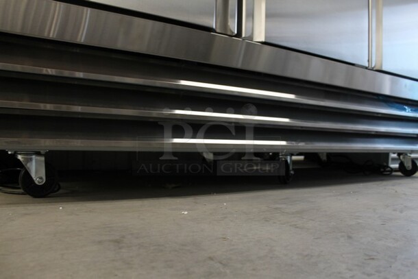 BRAND NEW SCRATCH AND DENT! 2023 Avantco 178SS3RHC Stainless Steel Commercial 3 Door Reach In Cooler Merchandiser w/ Poly Coated Racks on Commercial Casters. 115 Volts, 1 Phase. Tested and Working! - Image 3 of 7