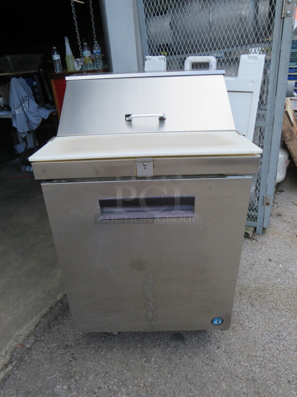 One WORKING Hoshizaki 1 Door Refrigerated Prep Table With 1 Rack, And A Cutting Board On Casters. 115 Volt. Model# CRMR27-8. 27X30.5X44. $3374.00. - Image 1 of 2