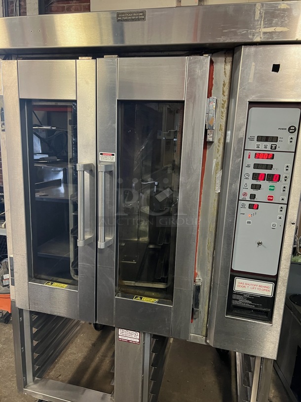 Stainless Steel Commercial Gas Powered Mini Rotating Rack Oven w/ View Through Doors and Lower Pan Rack on Commercial Casters. 48x36x75. Picture of the Unit Powered On Before Removal Is Included In the Listing. - Image 9 of 11