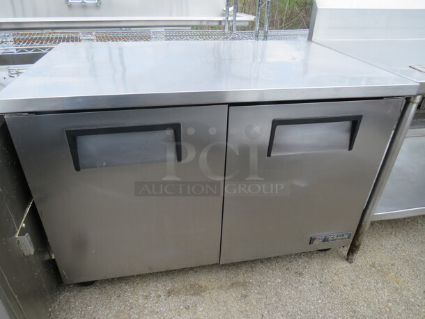 One WORKING True Stainless Steel 2 Door Under Counter Refrigerator On Casters. Model# TUC-48. 115 Volt. 48X30X35.5