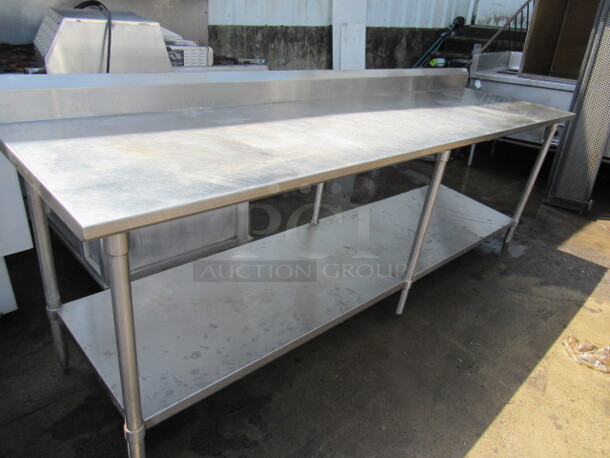 One Stainless Steel Table With Back Splash, And  Stainless Under Shelf. 108X30.5X41