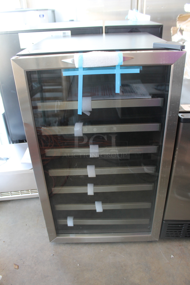BRAND NEW SCRATCH AND DENT! Danby DWC458BLS Designer Series Metal Wine Cooler / Wine Cellar Merchandiser with 45 Bottle Capacity, 7 Slide-Out Wooden Racks, Blue LED Lighting and Tempered Glass Door. 115 Volts, 1 Phase. Tested and Working!
 - Image 1 of 5