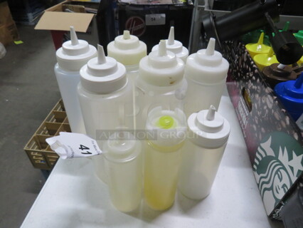One Lot Of 9 Squeeze Bottles.