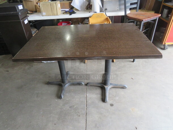 One Brown Laminate Table Top On A Dual Pedestal Base. 47X31X29