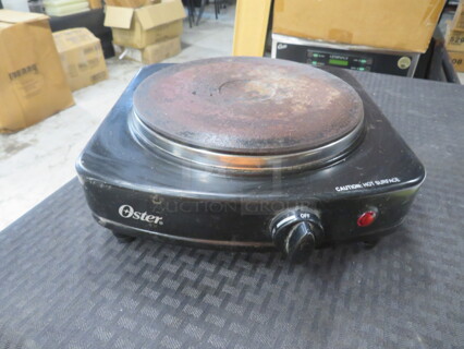 One Oster Single Burner. #CKSTSB100-B. 120 Volt. 900 Watt