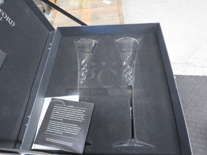 One Set Of 2 Waterford Crystal Shampagne Glasses.