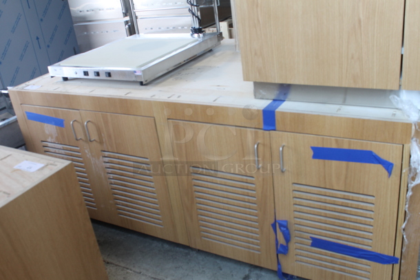 BRAND NEW! 4 Door Slotted Base Cabinet In Wood Style Finish.