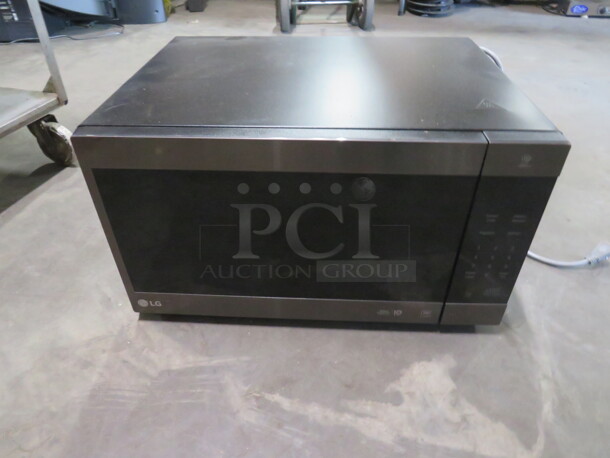 One LG Microwave. 1200 Watt. 120 Volt. Model# LMC2075BD/00. 24X20X13 - Image 1 of 1