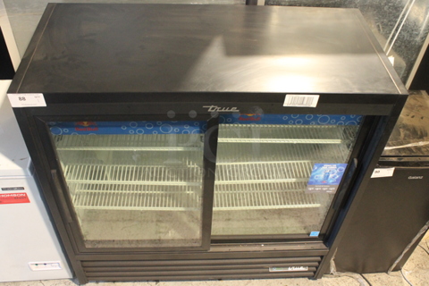 2023 True GDM-41SL-48-HC-LD Metal Commercial 2 Door Reach In Cooler Merchandiser w/ Poly Coated Racks. 115 Volts, 1 Phase. Tested and Working!