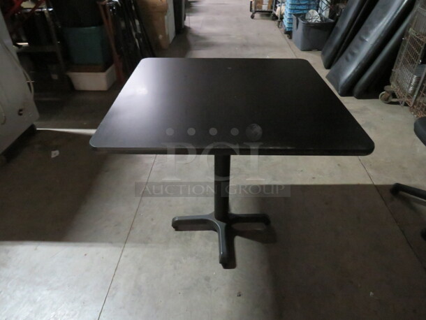 One Black Laminate Table Top On A Pedestal Base. 36X36X30