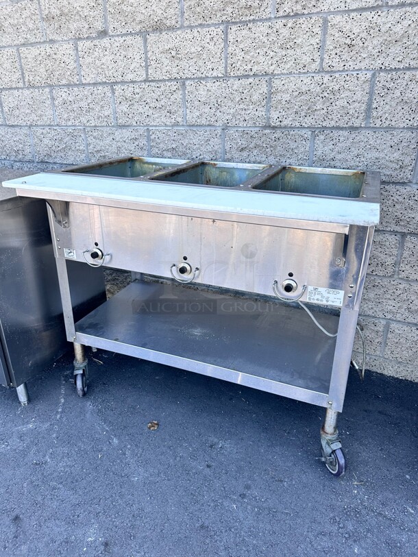 Late Model Duke E303 44 inch Hot Food Table w/ (3) Wells & Cutting Board, On Casters 115v/1ph Working  - Image 1 of 6