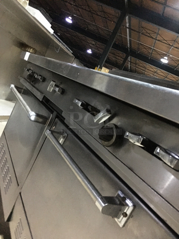 AN ANMAZING FIND! Garland 8 Burner Stove! With Left Side Hot Plate! With Back Splash! With 2 Full Size Ovens Underneath! With Metal Oven Racks! All Stainless Steel! On Casters! - Image 9 of 10