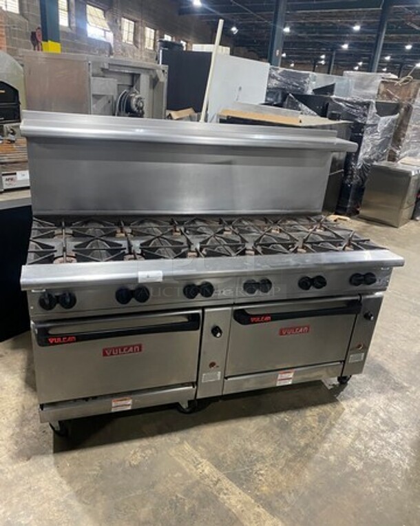 Vulcan Commercial Natural Gas Powered 12 Burner Stove! With Raised Back Splash And Salamander Shelf! With 2 Oven Underneath! All Stainless Steel! On Casters! WORKING WHEN REMOVED! Model: G72SS1AA SN: 659011300 - Image 1 of 11