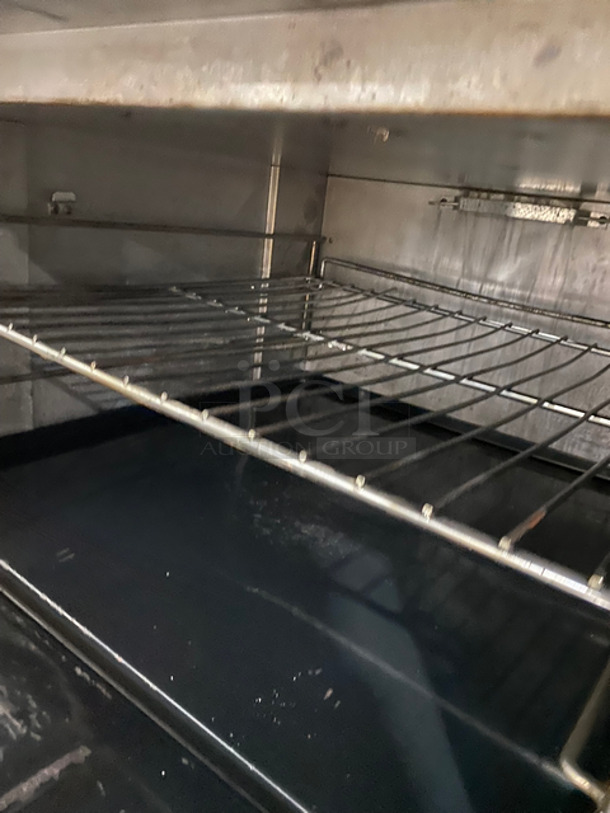 AMAZING! Therma Tek Commercial Natural Gas Powered Flat Top Griddle! With Right Side 2 Burners! Griddle Has Side Splashes! Raised Backsplash And Salamander Shelf! With Oven Underneath! Metal Oven Rack! All Stainless Steel! On Casters! - Image 10 of 11