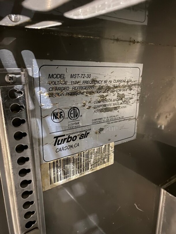 Turbo Air Commercial Refrigerated Mega Top Sandwich Prep Table! With 3 Door Storage Space Underneath! Poly Coated Racks! All Stainless Steel! On Casters! Model: MST7230 SN: 30MM7T611061 115V  - Image 8 of 9