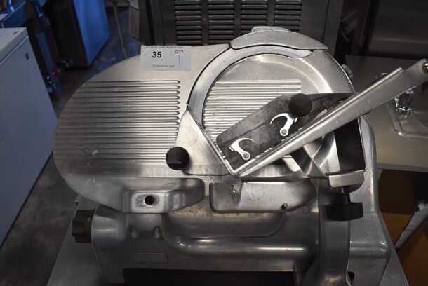 Berkel Stainless Steel Commercial Countertop Meat Slicer. 115 Volts, 1 Phase. 19x25x21. Tested and Powers On But Parts Do Not Move