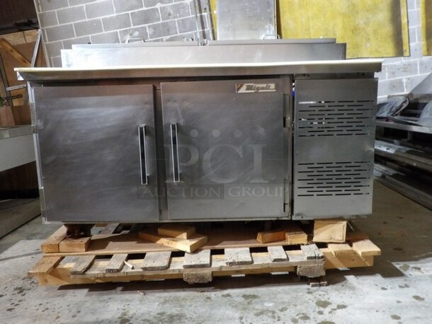 Migali Refrigerated Double Door Pizza Prep Station With Cutting Board. All Stainless Steel on Commercial Casters. One Phase Previous PCI Sale, Still on Pallet. 