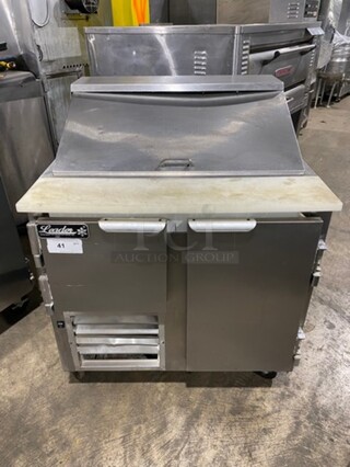 Leader Commercial Refrigerated Sandwich Prep Table! With 2 Door Underneath Storage Space! With Poly Coated Racks! With Commercial Cutting Board! All Stainless Steel! On Casters! Model: LM36 SN: PW08M1412 115V 60Hz 1 Phase
