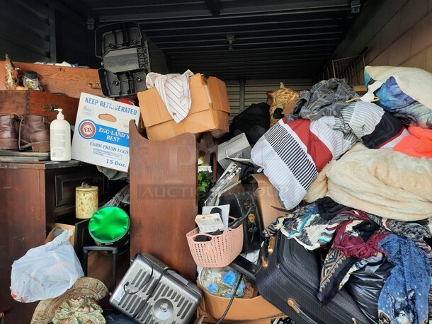 ALL ONE MONEY! Lot of Entire Contents of Storage Unit #29. Unit Size: 10 x 20. Unit Appears to Contain: Dressers, Bookshelves, Box Spring & Mattress, Wooden Bed, Couch, Chairs, Tables, Fan, Heaters, Bottle of Buttons, Longaberger Baskets, Lights, Mirror, Ironing Board, Rugs, Suitcases, Trashcan, Keurig, Blankets, Clothes, Shoes, Kerosene Heater, Large Stuffed Giraffe, Fake Plants, Bags, Totes & Boxes. Cleaning Deposit of $100 per Unit Paid on Pickup Day. Winner Has 7 Days From Close of Auction to Remove Items. All Items Must Be Removed and Unit Must Be Broom Swept to Get Cleaning Deposit Returned. Invoice and Cleaning Deposit Must Be Paid In Full by 4:00pm Tuesday, March 7th. Unit Must Be Cleared Out By 4:00pm Monday, March 13th. Please Come Into The Office To Settle Your Invoice and You Will Be Taken To Your Storage Unit for Cleanout. If You Plan To Clear Out Your Unit Saturday or Sunday You Need To Report To Our Office During The Week Before 4:00pm To Gain Access To Your Unit As Our Office Is Closed On Weekends. - Image 4 of 12