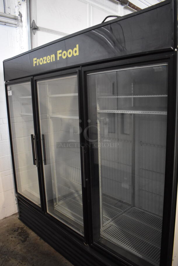 2014 True GDM-72F-LD Commercial Free Standing Electric Powered Triple Swing Glass Door Merchandiser Freezer In Black With Polycoated Racks. 115V/1 Phase Could Not Test Due To Different Plug Style - Image 2 of 8