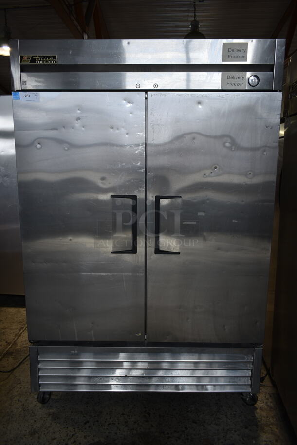 2013 True T-49F ENERGY STAR Stainless Steel Commercial 2 Door Reach In Freezer w/ Poly Coated Racks on Commercial Casters. 115 Volts, 1 Phase. Tested and Working! - Image 1 of 9