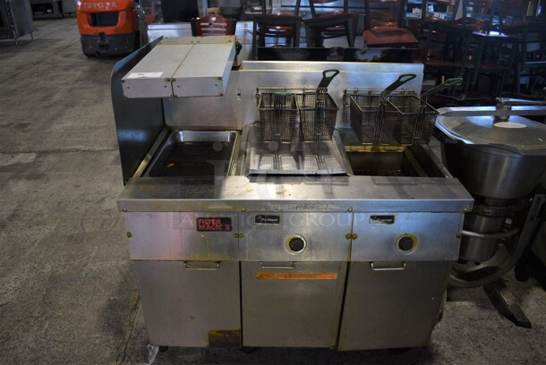 Frymaster Model FM235SD Stainless Steel Commercial Propane Gas Powered Deep Fat Fryer w/ Left Side Dumping Station, 4 Baskets and Lid on Commercial Casters. 110,000 BTU. 47x32x51 - Image 1 of 9